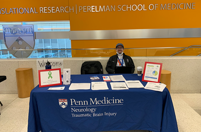 Nate running our information table at the Mind Your Brain Conference